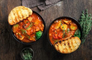 Two bowl of soup minestrone with seasonal vegetables. Italian food - obrazy, fototapety, plakaty