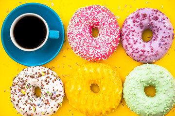 Bright colorful donuts and coffee