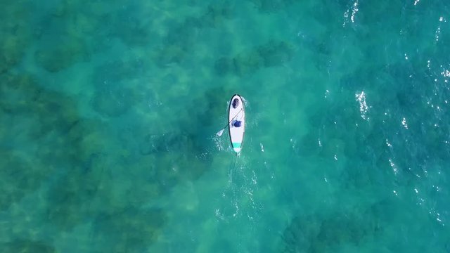 Sup surfer at sea - Aerial footage
