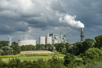 Fototapeta na wymiar Power plant producing huge amount of gas pollution