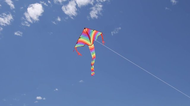 kite flying with nice clouds and blue sky