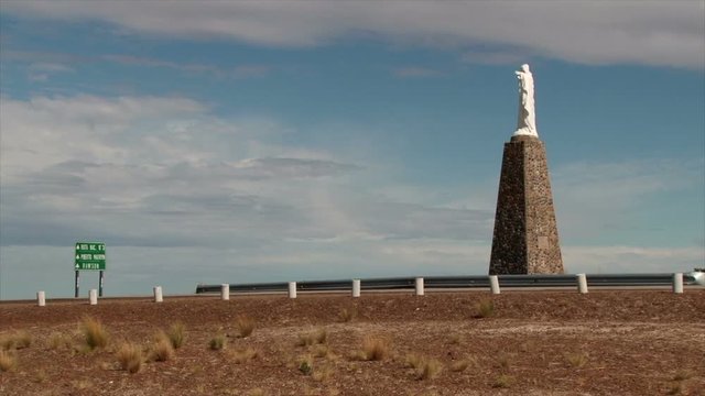 Car passes a statue outside the Centro de Interpretacion Istmo Ameghino visitor centre on the Valdez Peninsular. Argentina 