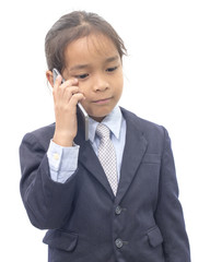 Asian boy in suit talking on mobile phone over white background