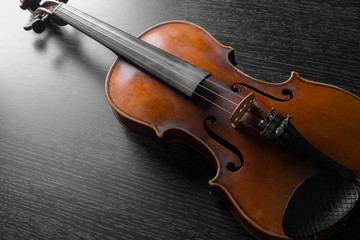 Fototapeta premium Old violin on a black background