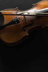 Fototapeta premium Old violin on a black background