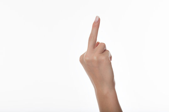 hand in a gesture meaning in Western cultures Fuck you or fuck off isolated on white background