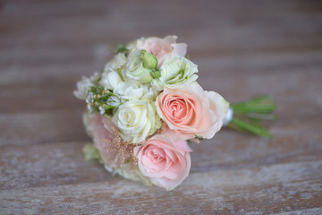 Pastel bridal round bouquet with pink and white roses. Floral arrangement ideas for the bride and bridesmaids