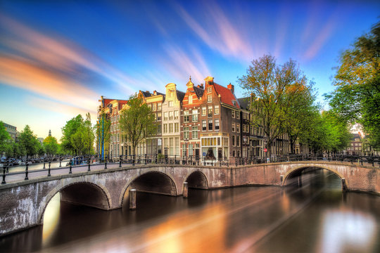 Beautiful sunset at the Emperors canal (Keizersgracht) and Leidse canal in Amsterdam in spring
