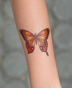 Naklejka Butterfly Sticker on child hand, Dress up tattoos.