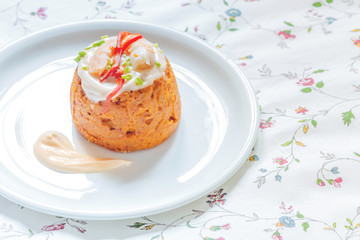 Delicious spanish Fish cake. Hake cake with tuna, tomato, shrimps, chive and salad cream.