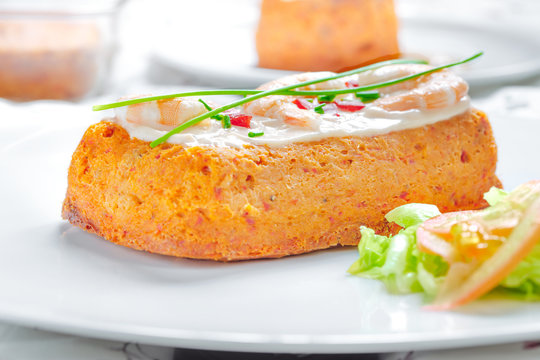 Delicious spanish Fish cake. Hake cake with tuna, tomato, shrimps, chive and salad cream.