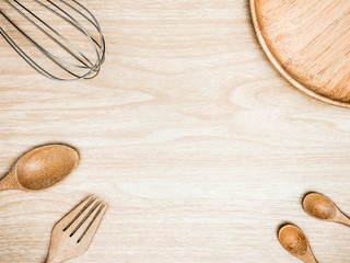 Utensil Kitchen Wooden and stainless whisk for cooking on wooden background. Top view white copy space.