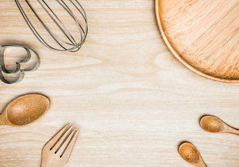 Utensil Kitchen Wooden and stainless whisk for cooking on wooden background. Top view white copy space.