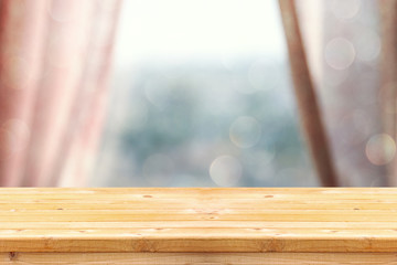 image of wooden table in front curtains. for product display and presentation