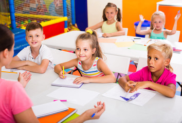 Fototapeta premium children sitting together and studying in class at school
