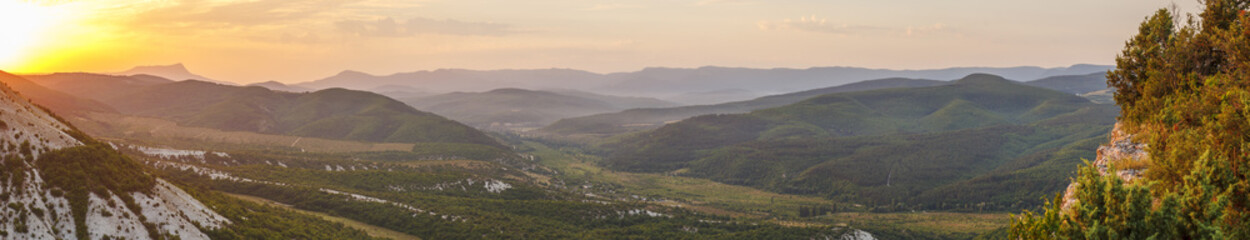 Panorama of the mountain open spaces in the Crimean mountains in the sunlight