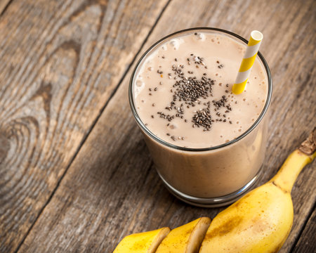 Banana Chocolate Smoothie Glass On Wooden Table