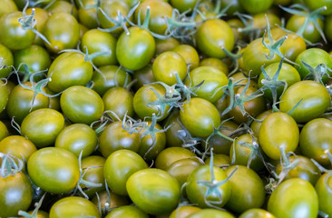 Organics green cherry tomatoes sold at  local city market. Provence. France