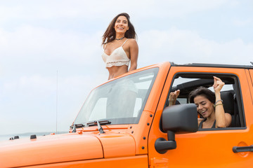 Two attractive young women laughing and having fun