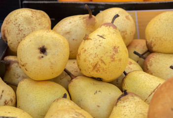 Fresh yellow pears sold at  local city market. Provence. France