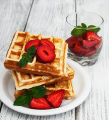 belgian waffles with strawberries and mint