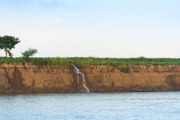 Waterfall on the Irrawaddy river, Mandalay, Myanmar, Burma. Copy space for text.