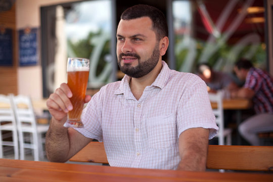 Handsome man drinking beer