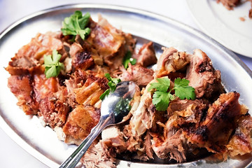 Pieces of meat in an iron plate