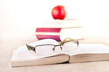 Eyeglasses on open book on table