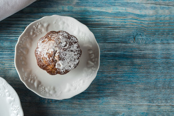 Cup cake on wooden table with empty background