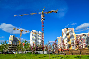 Fototapeta premium Construction crane at construction site in Moscow, Russia