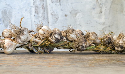 a bunch of organic garlic on a vintage table