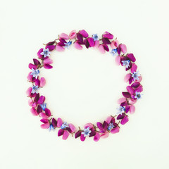 Flowers composition. Wreath made of various colorful flowers on white background. Easter, spring, summer, minimal concept. Flat lay, top view