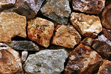 Rough rocks wall texture background. Brown stone wall texture background