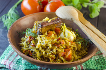 Pilaf on a platter with meat and spices