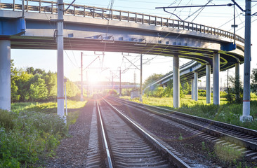 Naklejka premium Railroad tracks under the automobile overpass