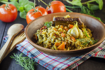 Pilaf on a platter with meat and spices