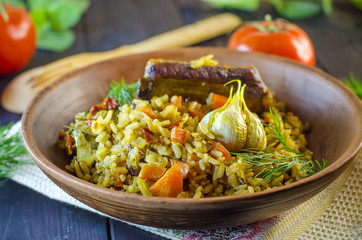 Pilaf on a platter with meat and spices