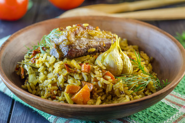 Pilaf on a platter with meat and spices