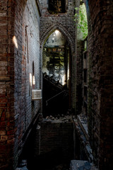 Fototapeta na wymiar Collapsing Floor & Brick Arch - Abandoned Church