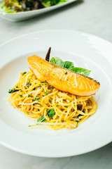 Spaghetti and Pasta with salmon fillet meat