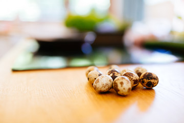 Healthy quail eggs on kitchen table
