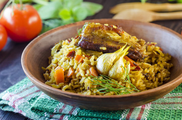 Pilaf on a platter with meat and spices