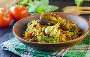 Pilaf on a platter with meat and spices