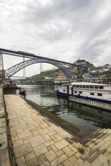 View of Ribeira historical quarter, on the margin Douro river embankment Oporto old town and  Luis I bridge, Porto.