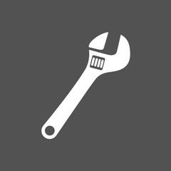 Wrench icon on dark background