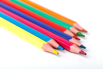 Fototapeta premium Color pencils isolated on white background. Many different colored pencils. Colored drawing pencils in a variety of colors