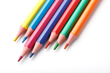 Color pencils isolated on white background. Many different colored pencils. Colored drawing pencils in a variety of colors