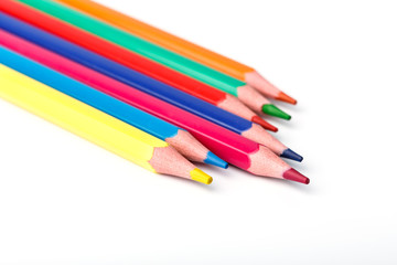 Color pencils isolated on white background. Many different colored pencils. Colored drawing pencils in a variety of colors