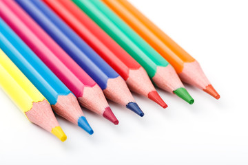 Obraz premium Color pencils isolated on white background. Many different colored pencils. Colored drawing pencils in a variety of colors